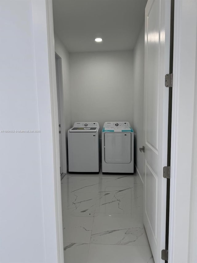 3004 SW 4th St, Lehigh Acres, FL 33976 - clothes washing area featuring marble finish flooring, washing machine and dryer, and recessed lighting