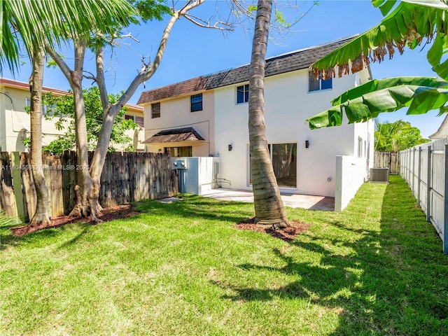 2039 NE 172nd St, North Miami Beach, FL 33162 - rear view of property with stucco siding, central air condition unit, a shingled roof, and a patio