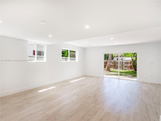 2039 NE 172nd St, North Miami Beach, FL 33162 - empty room with plenty of natural light, light wood-style flooring, baseboards, and recessed lighting