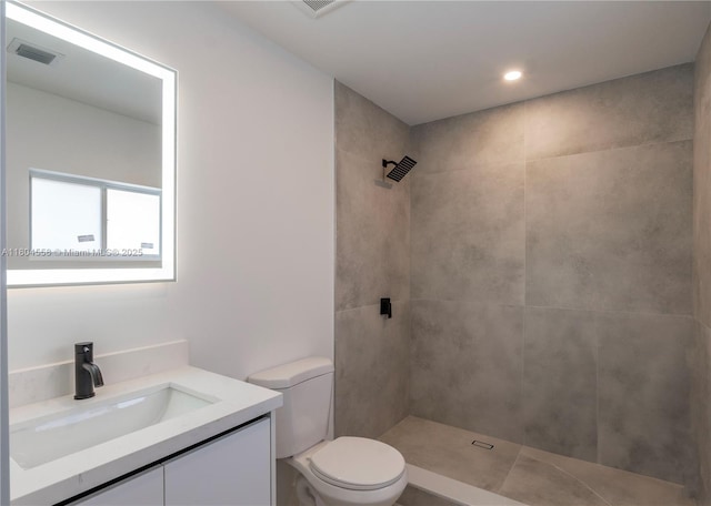 2039 NE 172nd St, North Miami Beach, FL 33162 - full bathroom with toilet, a tile shower, vanity, and recessed lighting