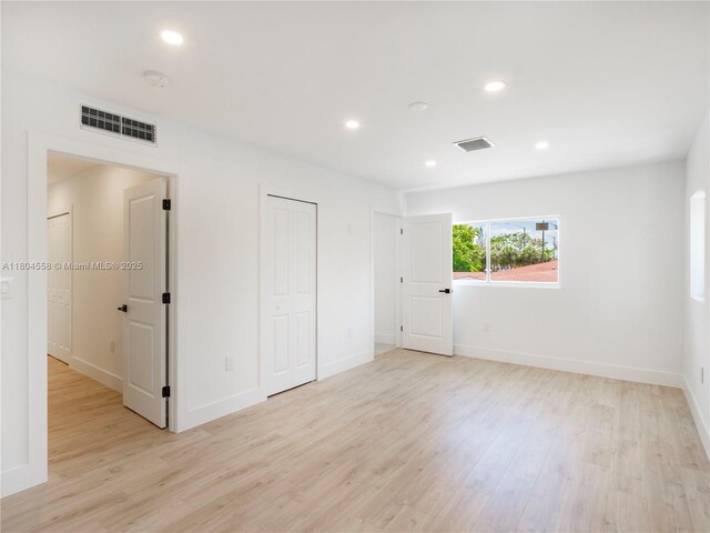 2039 NE 172nd St, North Miami Beach, FL 33162 - unfurnished bedroom featuring light wood finished floors, recessed lighting, baseboards, and a closet
