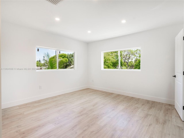 2039 NE 172nd St, North Miami Beach, FL 33162 - unfurnished room featuring plenty of natural light, light wood-type flooring, recessed lighting, and baseboards