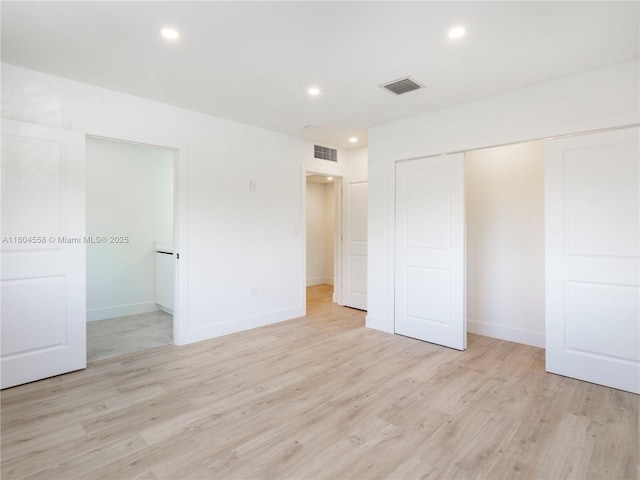 2039 NE 172nd St, North Miami Beach, FL 33162 - unfurnished bedroom featuring light wood-style flooring, recessed lighting, baseboards, and a closet