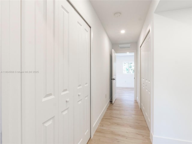 2039 NE 172nd St, North Miami Beach, FL 33162 - hallway featuring light wood-style flooring, baseboards, and recessed lighting
