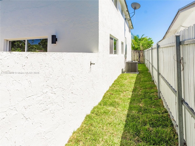 2039 NE 172nd St, North Miami Beach, FL 33162 - view of home's exterior featuring stucco siding and central AC unit