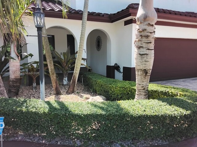 21046 SW 133rd Ct, Miami, FL 33177 - property entrance with a tiled roof and stucco siding