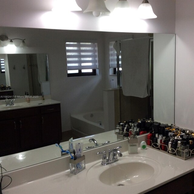 21046 SW 133rd Ct, Miami, FL 33177 - full bathroom featuring a garden tub and vanity