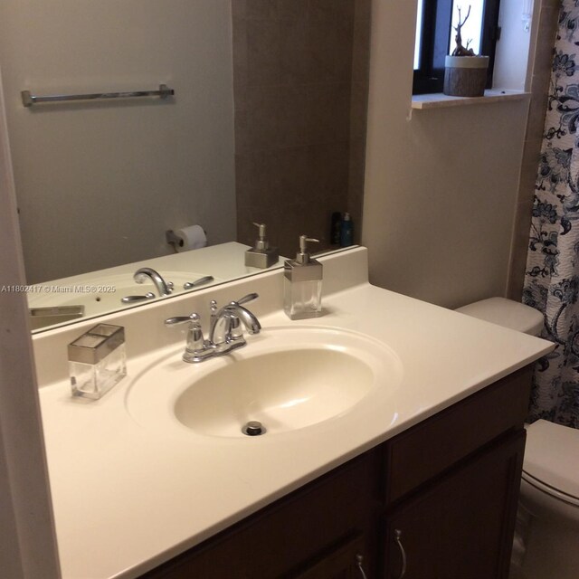 21046 SW 133rd Ct, Miami, FL 33177 - bathroom featuring toilet, vanity, and curtained shower