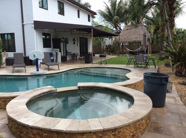 21046 SW 133rd Ct, Miami, FL 33177 - view of pool with a patio area and a pool with connected hot tub