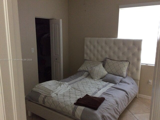 21046 SW 133rd Ct, Miami, FL 33177 - tiled bedroom with baseboards