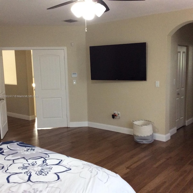 21046 SW 133rd Ct, Miami, FL 33177 - bedroom with arched walkways, wood finished floors, baseboards, a ceiling fan, and a closet