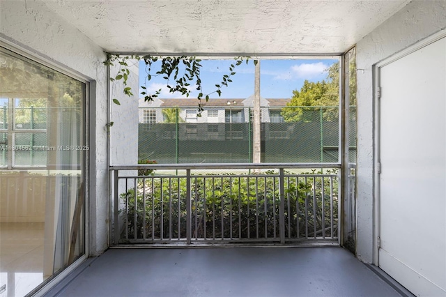 unfurnished sunroom with healthy amount of natural light