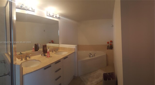 16699 Collins Ave Unit 3601, Sunny Isles Beach, FL 33160 - bathroom featuring a bath, tile patterned floors, and double vanity