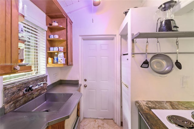 1301 Milan Ave Unit 4, Coral Gables, FL 33134 - kitchen featuring open shelves, a sink, dark countertops, and white electric stovetop