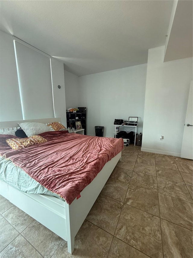 9066 SW 73rd Ct Unit 2401, Miami, FL 33156 - tiled bedroom featuring baseboards