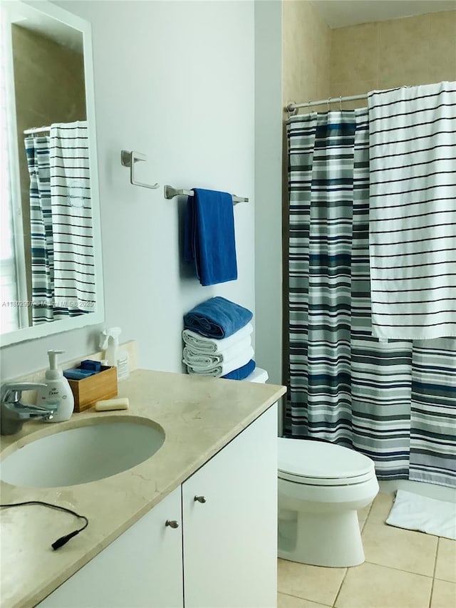 9066 SW 73rd Ct Unit 2401, Miami, FL 33156 - full bath featuring tile patterned flooring, vanity, toilet, and a shower with curtain