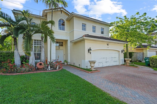 15120 SW 156th Ave, Miami, FL 33196 - mediterranean / spanish house featuring stucco siding, a garage, and decorative driveway