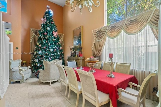 15120 SW 156th Ave, Miami, FL 33196 - dining space with a chandelier, a high ceiling, and tile patterned flooring