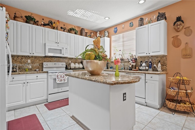 15120 SW 156th Ave, Miami, FL 33196 - kitchen with white appliances, tasteful backsplash, white cabinets, a kitchen island, and recessed lighting