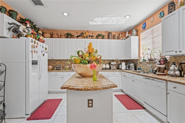 15120 SW 156th Ave, Miami, FL 33196 - kitchen with white appliances, a sink, a center island, decorative backsplash, and light tile patterned flooring