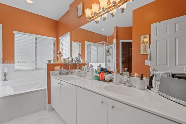 15120 SW 156th Ave, Miami, FL 33196 - bathroom featuring a chandelier, a garden tub, a stall shower, and double vanity
