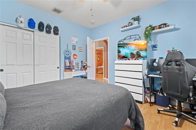 15120 SW 156th Ave, Miami, FL 33196 - bedroom with light wood-style flooring, a closet, and a desk
