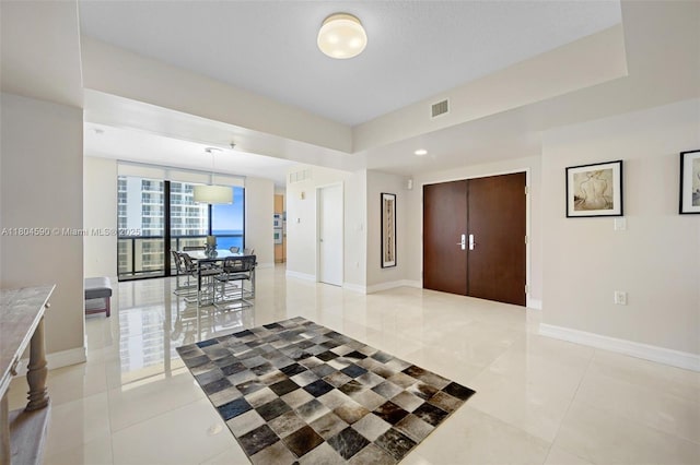 16275 Collins Ave Unit 1202, Sunny Isles Beach, FL 33160 - foyer entrance featuring light tile patterned floors and baseboards
