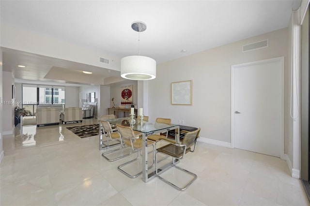 16275 Collins Ave Unit 1202, Sunny Isles Beach, FL 33160 - dining area featuring baseboards and light tile patterned floors