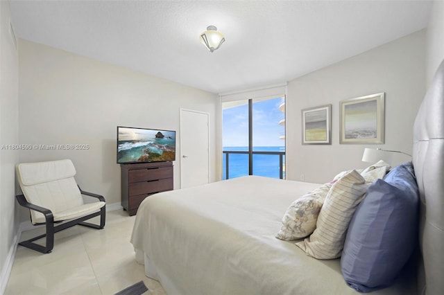 16275 Collins Ave Unit 1202, Sunny Isles Beach, FL 33160 - bedroom with a wall of windows, baseboards, and access to outside