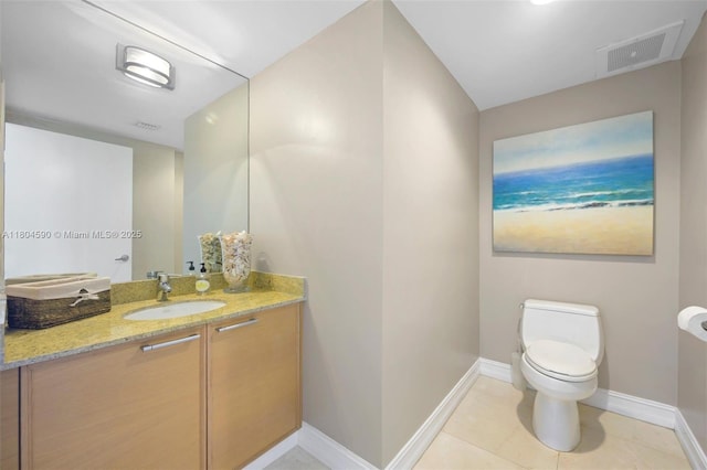 16275 Collins Ave Unit 1202, Sunny Isles Beach, FL 33160 - bathroom featuring baseboards, toilet, vanity, and tile patterned floors