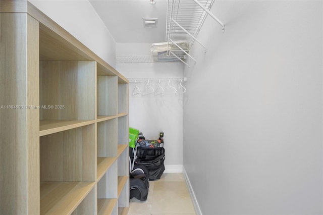 16275 Collins Ave Unit 1202, Sunny Isles Beach, FL 33160 - walk in closet featuring tile patterned flooring
