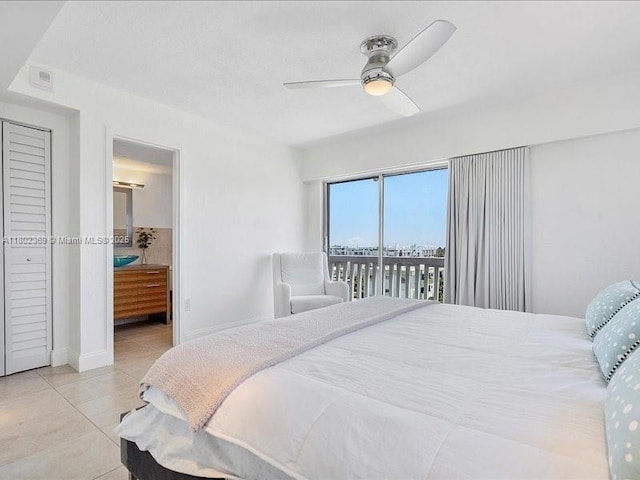 7620 Carlyle Ave Unit 702, Miami Beach, FL 33141 - tiled bedroom with access to exterior, a ceiling fan, connected bathroom, and baseboards