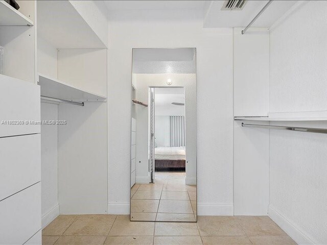 7620 Carlyle Ave Unit 702, Miami Beach, FL 33141 - spacious closet with light tile patterned flooring