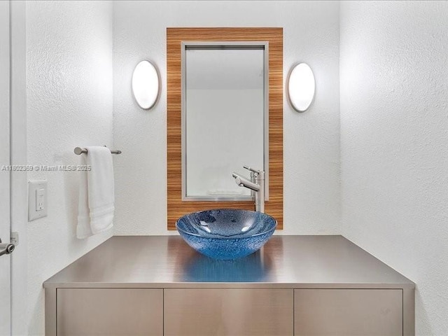 7620 Carlyle Ave Unit 702, Miami Beach, FL 33141 - bathroom featuring vanity and a textured wall