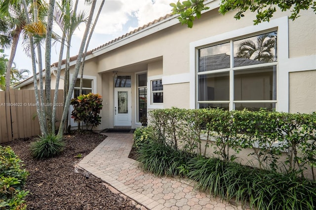6670 NW 27th Ave, Boca Raton, FL 33496 - entrance to property featuring stucco siding and fence