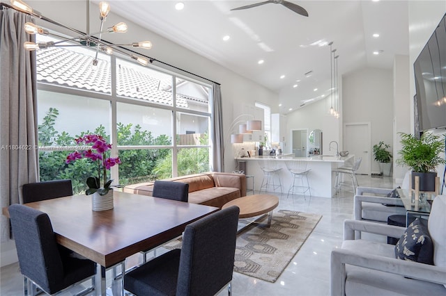6670 NW 27th Ave, Boca Raton, FL 33496 - dining space featuring high vaulted ceiling, recessed lighting, a chandelier, ceiling fan, and light marble finish floors