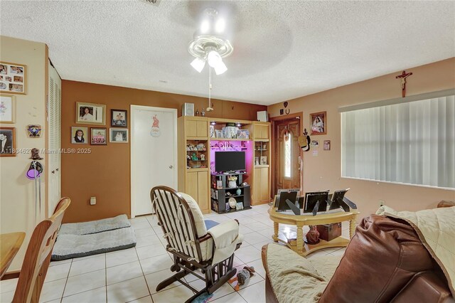 13504 SW 68th Ter, Miami, FL 33183 - living room with a ceiling fan, light tile patterned floors, and a textured ceiling