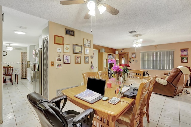 13504 SW 68th Ter, Miami, FL 33183 - dining room featuring ceiling fan, light tile patterned flooring, and a textured ceiling
