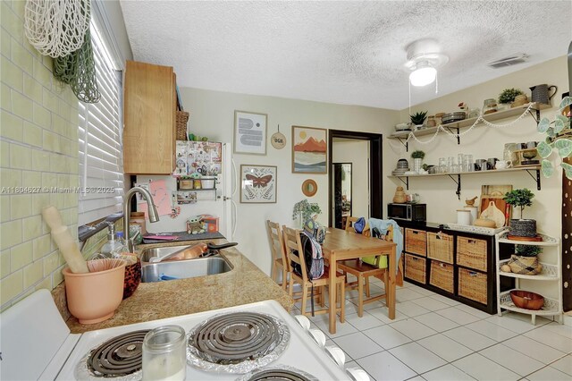 13504 SW 68th Ter, Miami, FL 33183 - dining area with a textured ceiling and light tile patterned floors