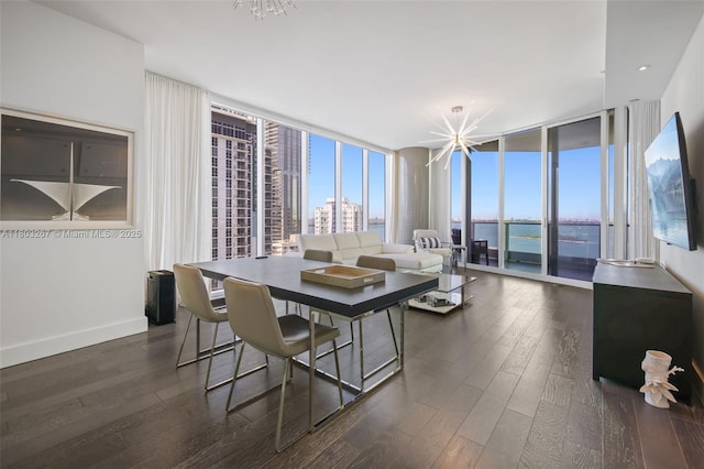 2020 N Bayshore Dr Unit 2001, Miami, FL 33137 - dining space featuring a wall of windows, dark wood-type flooring, and a chandelier