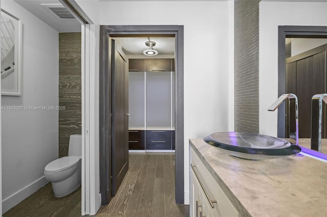 2020 N Bayshore Dr Unit 2001, Miami, FL 33137 - bathroom featuring wood finished floors, toilet, and vanity