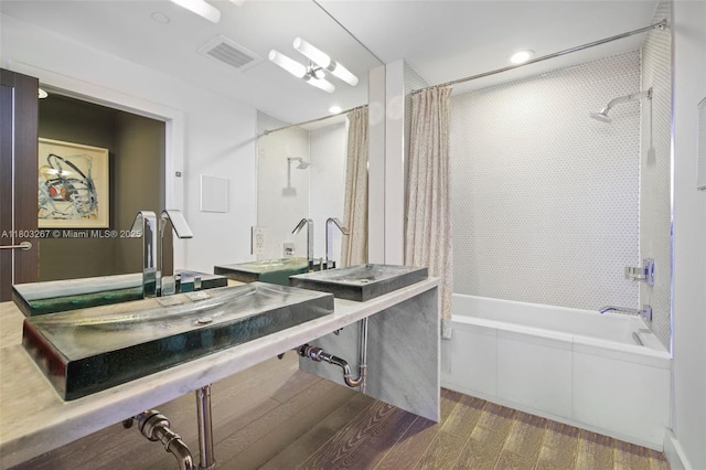 2020 N Bayshore Dr Unit 2001, Miami, FL 33137 - bathroom featuring shower / tub combo with curtain, wood finished floors, and recessed lighting