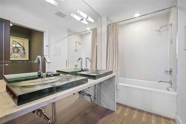 2020 N Bayshore Dr Unit 2001, Miami, FL 33137 - full bath with shower / bath combo, wood finished floors, and recessed lighting