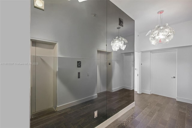 2020 N Bayshore Dr Unit 2001, Miami, FL 33137 - foyer featuring a chandelier, wood finished floors, and elevator