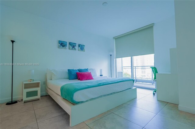 90 SW 3rd St Unit 1401, Miami, FL 33130 - bedroom with tile patterned flooring and baseboards