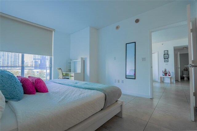 90 SW 3rd St Unit 1401, Miami, FL 33130 - bedroom featuring light tile patterned floors and baseboards
