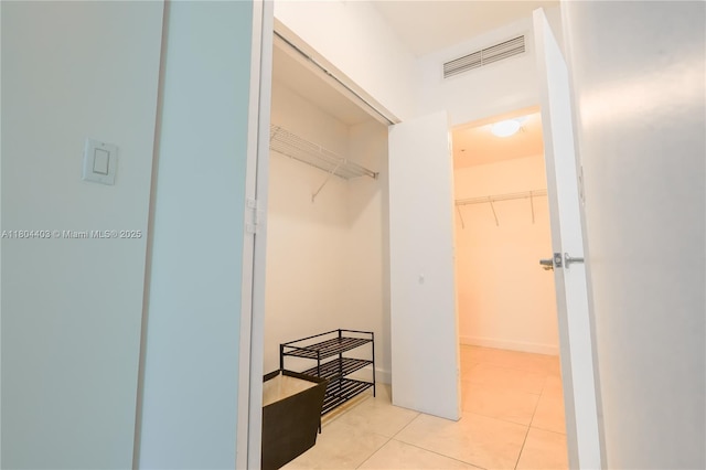 90 SW 3rd St Unit 1401, Miami, FL 33130 - walk in closet with light tile patterned flooring