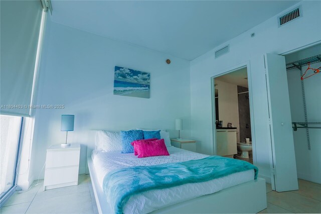 90 SW 3rd St Unit 1401, Miami, FL 33130 - tiled bedroom with ensuite bathroom and a closet