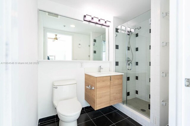 665 NE 25th St Unit 405, Miami, FL 33137 - full bathroom with a shower stall, tile patterned flooring, vanity, a ceiling fan, and toilet