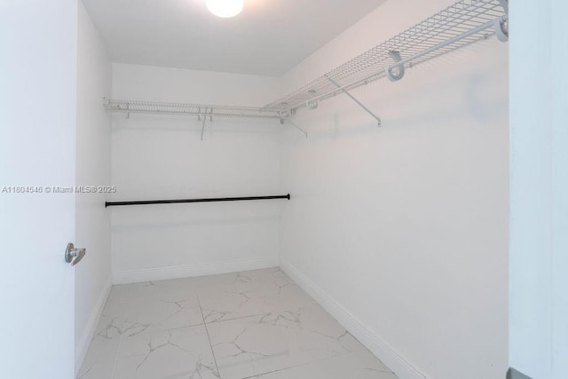 665 NE 25th St Unit 405, Miami, FL 33137 - spacious closet featuring light marble finish flooring